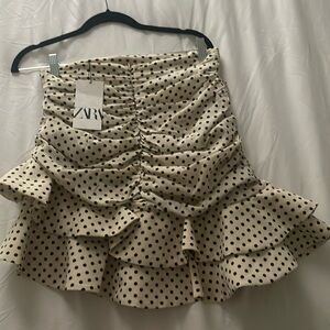 Polka dot asymmetrical skirt